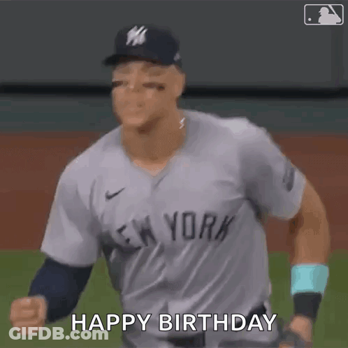 A Baseball Player In A New York Yankees Uniform Is Celebrating His Birthday On The Field . GIF