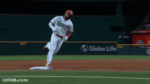 A Baseball Player In A Rangers Jersey Is Running To Base GIF