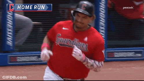 A Baseball Player In A Red Guardians Uniform Is Running On The Field GIF