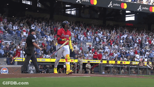 A Baseball Player In A Red Uniform With The Word Braves On The Back GIF