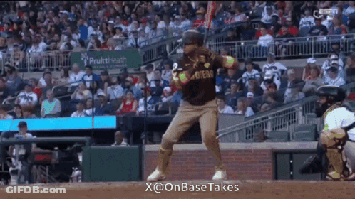 A Baseball Player In A San Diego Padres Jersey Stands On The Field GIF