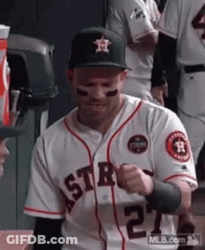 A Baseball Player In A White Jersey With The Number 27 On It GIF
