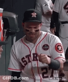 A Baseball Player In A White Jersey With The Number 27 On It GIF