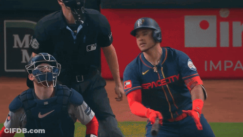 A Baseball Player In Front Of A Reliant Ad GIF