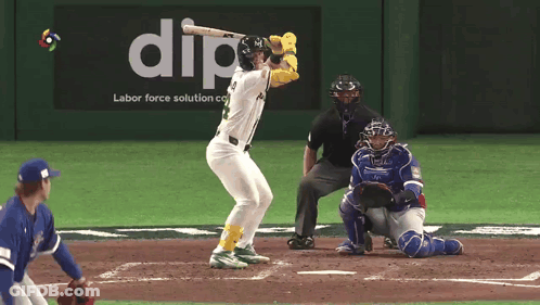 A Baseball Player Is At Bat In Front Of An Ad For Dip Labor Force Solution GIF