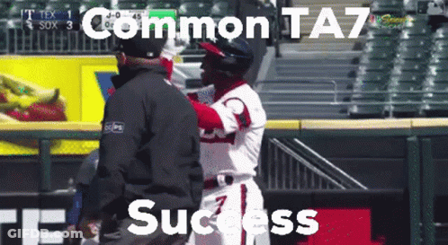 A Baseball Player Is Being Hugged By A Referee With The Words " Common Ta7 Success " Above Him GIF