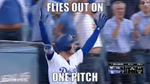 A Baseball Player Is Celebrating A Home Run With His Arms In The Air And A Caption That Says Flies Out On One Pitch . GIF