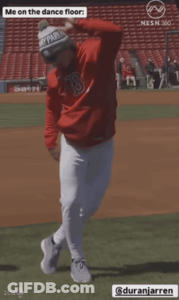 A Baseball Player Is Dancing On The Dance Floor While Wearing A Red Shirt With The Letter B On It GIF