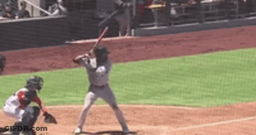 A Baseball Player Is Getting Ready To Hit The Ball GIF