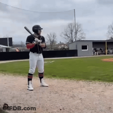 A Baseball Player Is Getting Ready To Swing At The Ball GIF