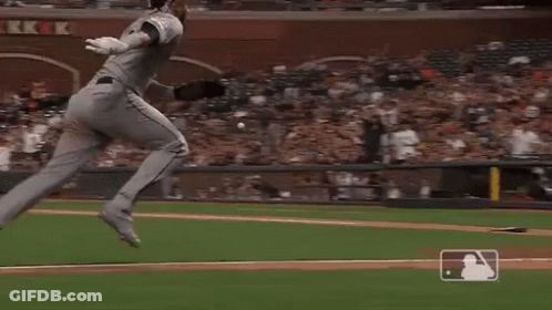 A Baseball Player Is Getting Ready To Throw A Ball While A Catcher Looks On . GIF