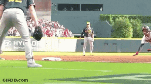 A Baseball Player Is Getting Ready To Throw A Ball While Another Player Watches . GIF