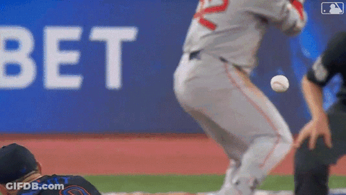 A Baseball Player Is Getting Ready To Throw The Ball While Another Player Watches . GIF