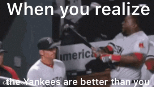 A Baseball Player Is Holding A Bat And Talking To Another Player In The Dugout . GIF