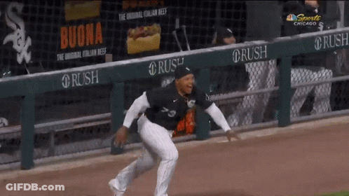 A Baseball Player Is Running On The Field In Front Of A Banner For Buona GIF