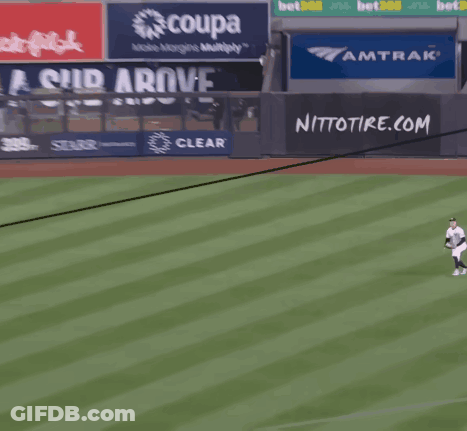 A Baseball Player Is Running On The Field In Front Of A Sign For Nitto Tire.com GIF