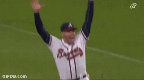 A Baseball Player Is Running On The Field While Wearing A Braves Jersey . GIF