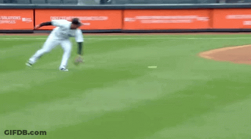 A Baseball Player Is Running On The Field With A Glove GIF