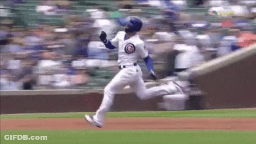A Baseball Player Is Running Towards A Base During A Game . GIF
