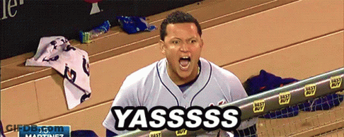 A Baseball Player Is Screaming In The Dugout And The Word Yassss Is On The Screen Behind Him GIF