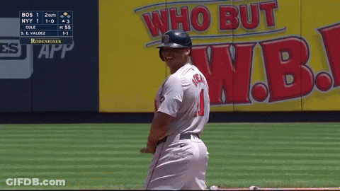 A Baseball Player Is Smiling In Front Of A Wall That Says Who But W.b. GIF