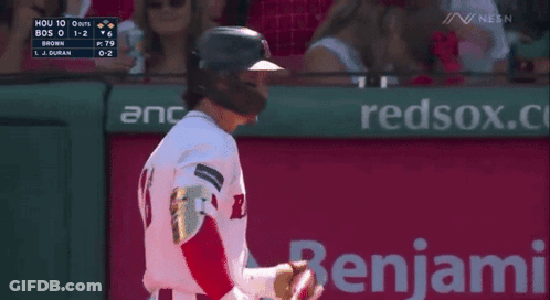 A Baseball Player Is Standing In Front Of A Neca Ad GIF