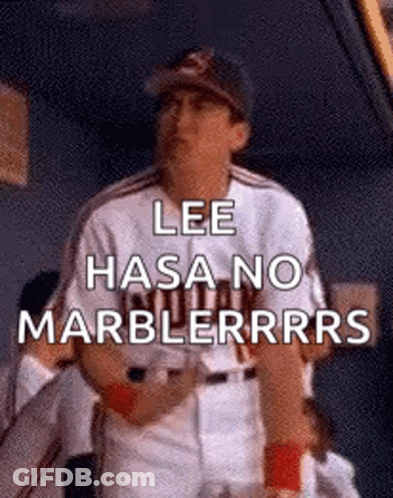 A Baseball Player Is Standing In The Dugout And Says `` Lee Hasa No Marblerrrs '' . GIF