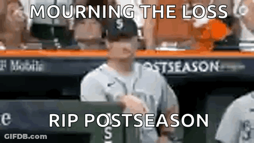 A Baseball Player Is Standing In The Dugout With A Sign That Says Mourning The Loss Rip Postseason GIF