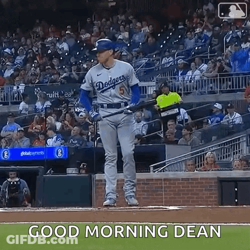 A Baseball Player Is Standing On A Baseball Field With A Bat In His Hand . GIF