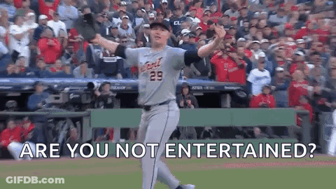 A Baseball Player Is Standing On A Baseball Field With His Arms Outstretched And The Words `` Are You Not Entertained ? GIF