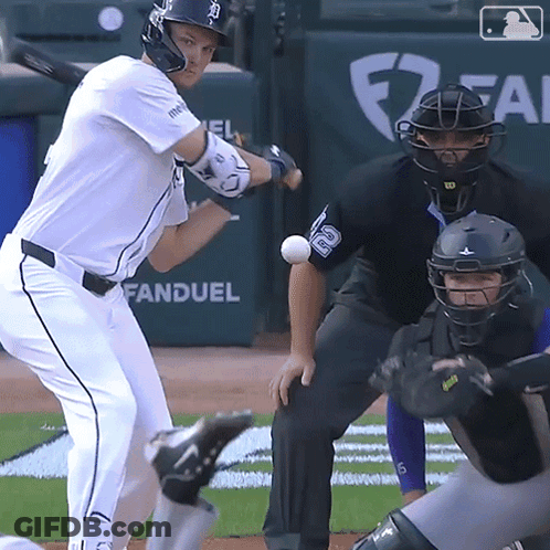 A Baseball Player Is Swinging At A Ball With The Word Fan Duel Behind Him GIF