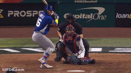 A Baseball Player Is Swinging At A Pitch In Front Of A Capital One Advertisement GIF