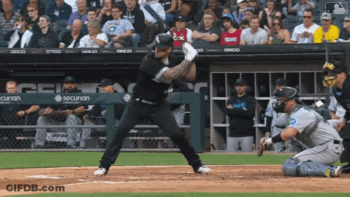 A Baseball Player Is Swinging At A Pitch In Front Of A Sign That Says Securan GIF
