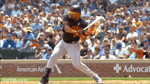 A Baseball Player Is Swinging His Bat In Front Of An American Airlines Banner GIF