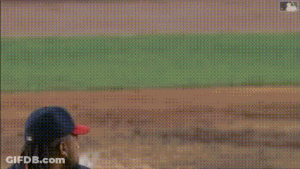 A Baseball Player Is Trying To Catch The Ball While A Catcher Is Kneeling Down GIF