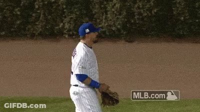 A Baseball Player Is Walking On The Field With A Mlb.com Sign In The Background GIF