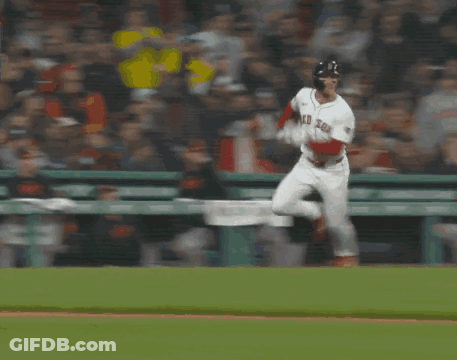 A Baseball Player Laying On The Ground In Front Of A Coca Cola Ad GIF