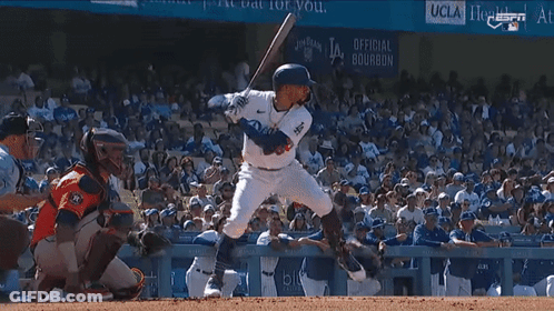 A Baseball Player Named Betts Swings His Bat At A Pitch GIF