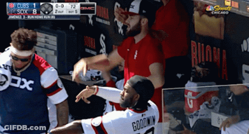 A Baseball Player Named Goodwin Is Being Hugged By Another Player GIF