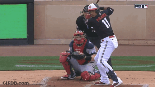 A Baseball Player Named Polanco Is About To Swing At A Pitch GIF