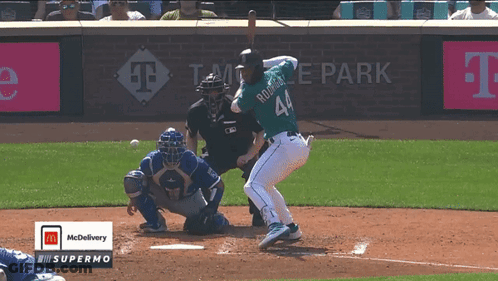 A Baseball Player Named Rodriguez Is Swinging At A Ball GIF