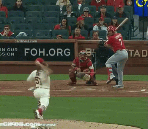 A Baseball Player Named Smith Is Swinging His Bat At A Pitch GIF