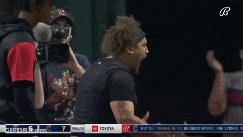 A Baseball Player Screams In Front Of A Toyota Logo GIF