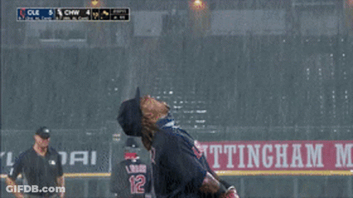 A Baseball Player Stands In Front Of A Sign That Says Ettingha GIF