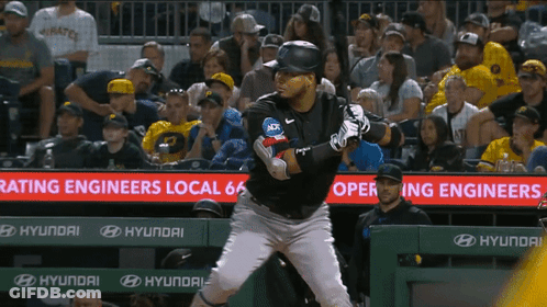A Baseball Player Stands In Front Of A Sign That Says Rating Engineers GIF