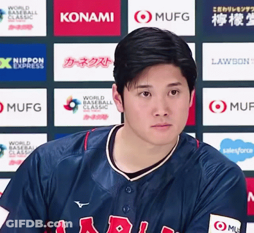 A Baseball Player Stands In Front Of A Wall That Has Konami And Mufg Logos On It GIF