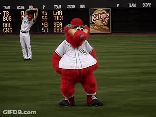 A Baseball Player Stretches His Arms In Front Of A Kahn 'S Sign GIF