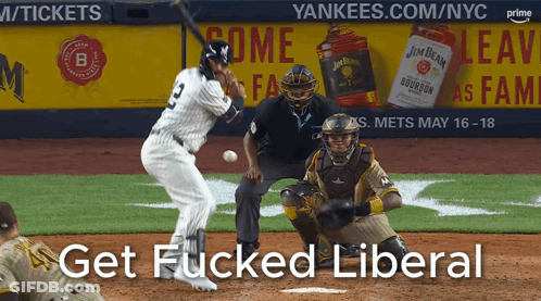 A Baseball Player Swings At A Ball In Front Of A Jim Beam Ad GIF