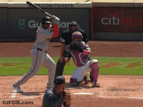A Baseball Player Swings His Bat At A Ball In Front Of A Wall That Says Citi Field GIF