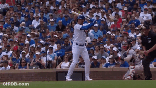 A Baseball Player Swings His Bat In Front Of A Crowd Wearing A Jersey That Says ' Chicago ' On It GIF